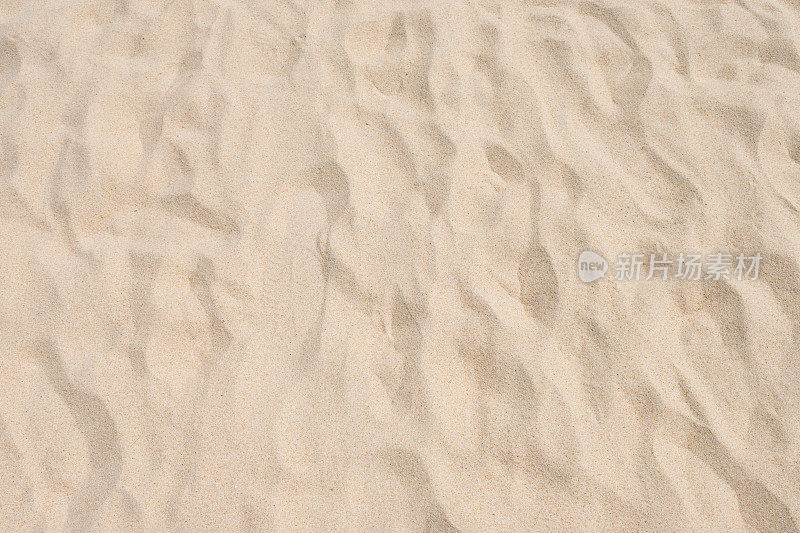 在夏天沙滩的沙粒图案的特写