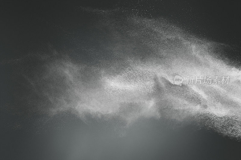 黑色背景上的白色粉末云抽象设计