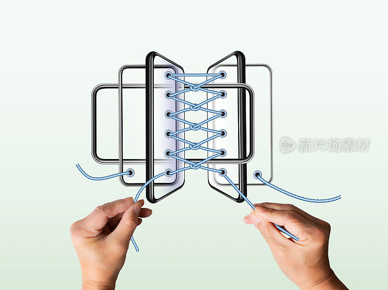 多部智能手机编织成绳子一样的鞋带。人的手编织绳子。