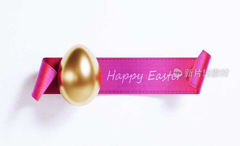 粉红色缎子横幅上的金色复活节彩蛋