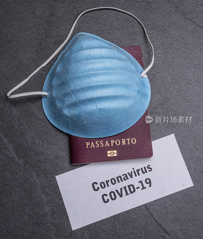 冠状病毒和旅游概念。注意COVID-19和护照。