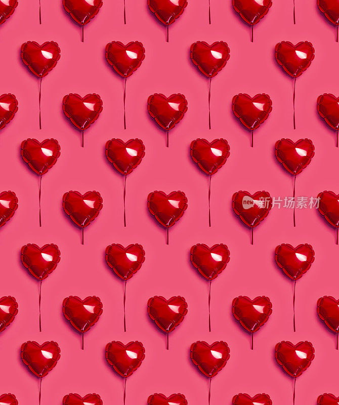 无缝模式的红色气球在粉红色背景上的心形顶部视图平铺复制空间。爱的概念。节日对象，生日，情人节，婚礼。聚会装饰。贺卡