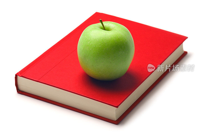 红精装书上的绿苹果