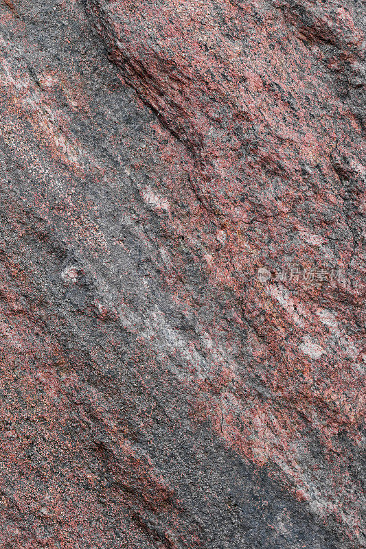 天然未经处理的花岗岩层的图案和纹理。石材表面作背景
