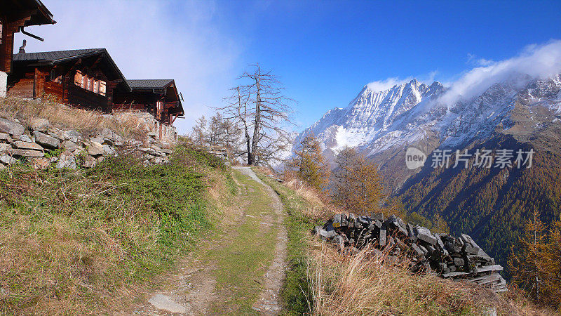 蜿蜒穿过瑞士小屋村的山路