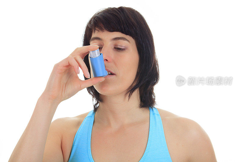 女人哮喘吸入器