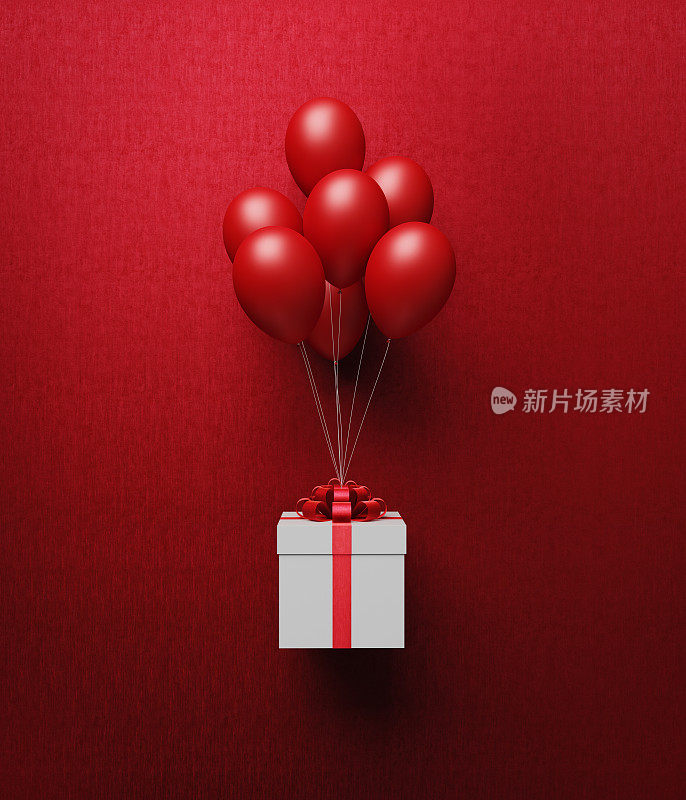 用红丝带系着的白色礼盒被红气球带走