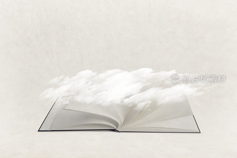 飘渺的云悬挂在一本打开的书