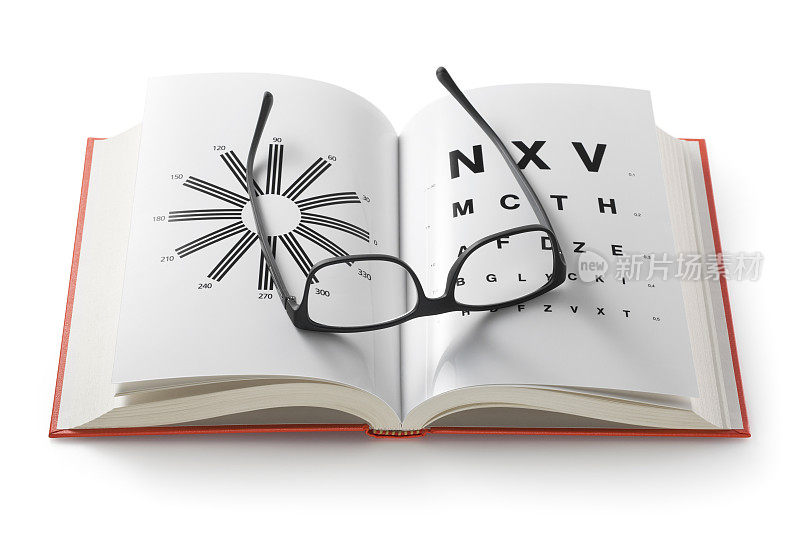 眼镜在书上附有视力测试表
