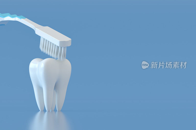 牙刷和白色牙齿上的蓝色背景牙齿护理