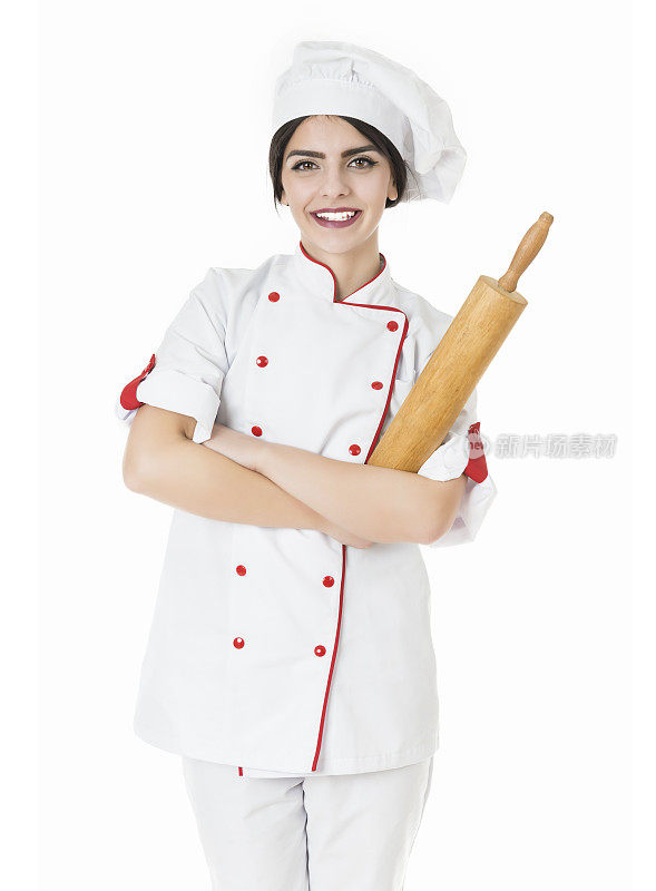 年轻迷人的女面包师，厨师拿着烘焙擀面杖