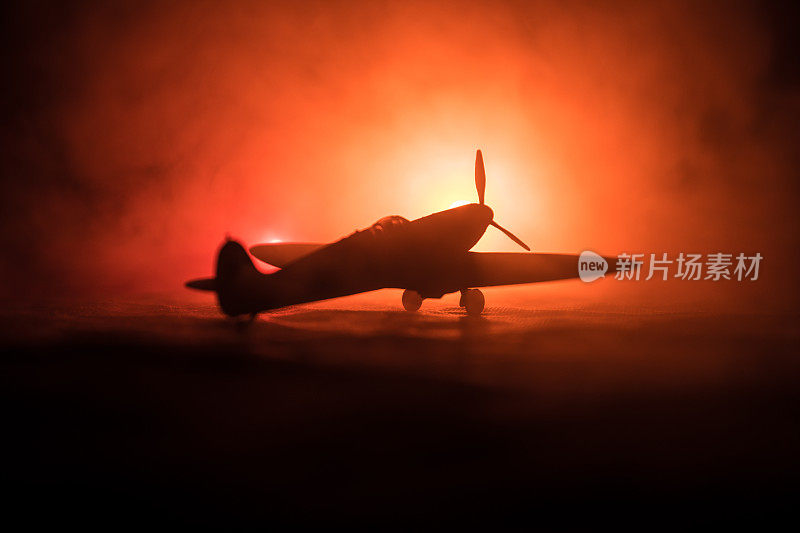 英国喷气推进模型飞机。暗橙色的火背景。战争的场景。
