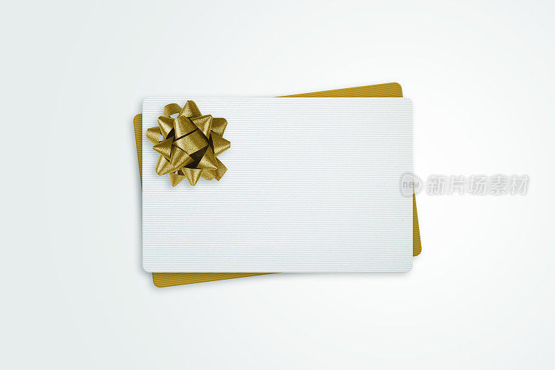 白色和金色礼品卡与金色蝴蝶结丝带