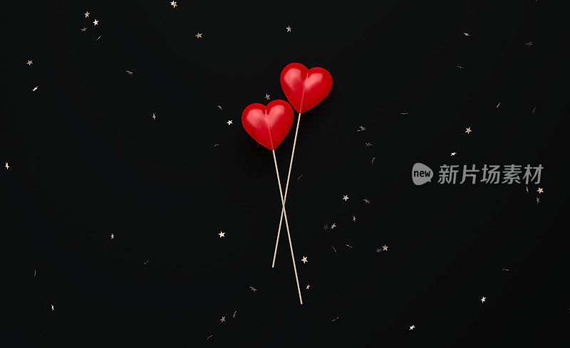情人节概念-星星形状的五彩纸屑在黑色背景上落在心形棒棒糖上