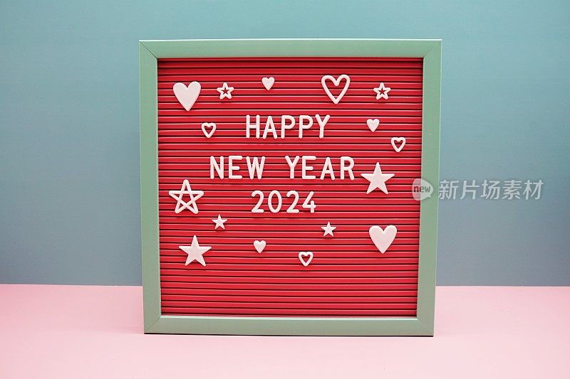 新年快乐2024字母在粉红色和蓝色的背景
