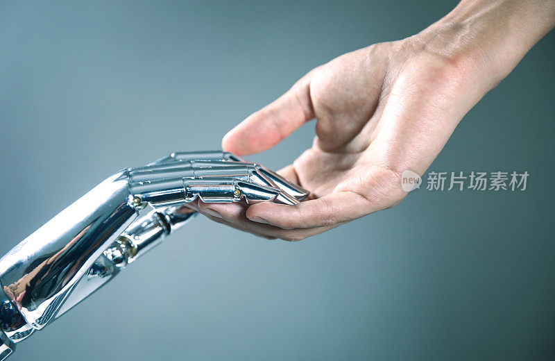 机器人的手和人类的手相互接触