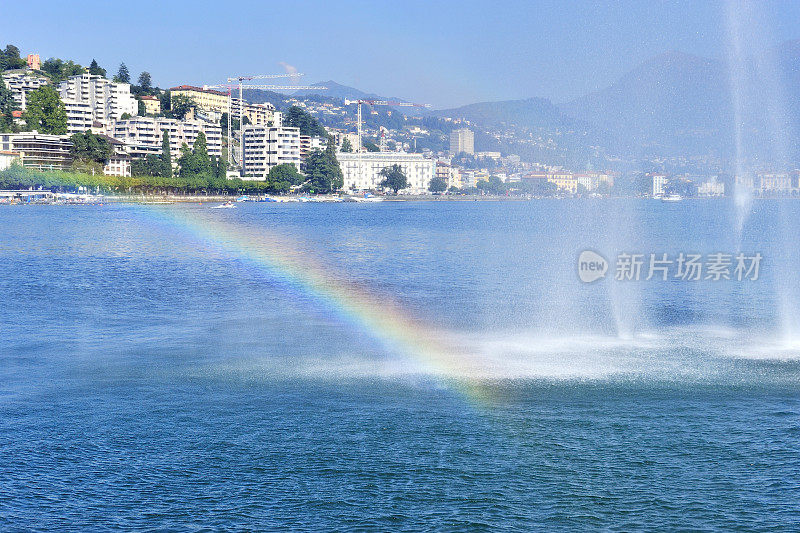 喷泉和彩虹在日内瓦城市景观背景，瑞士