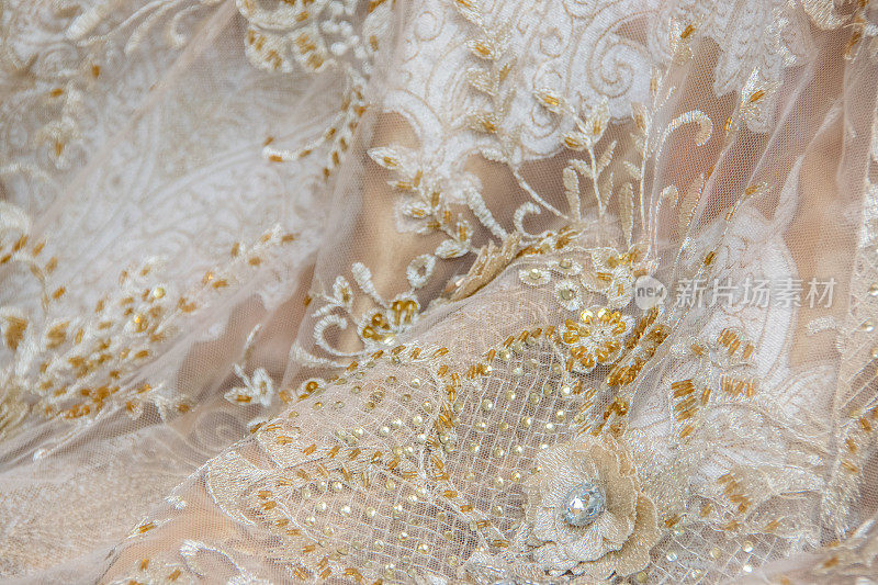 纺织花边背景-接近的服装蕾丝晚礼服或婚礼新娘