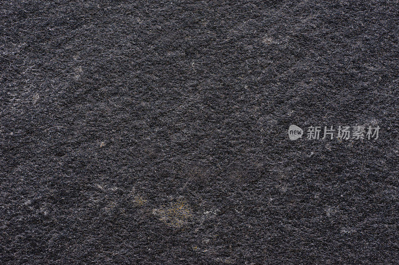 黑色石材纹理表面。岩石图案背景