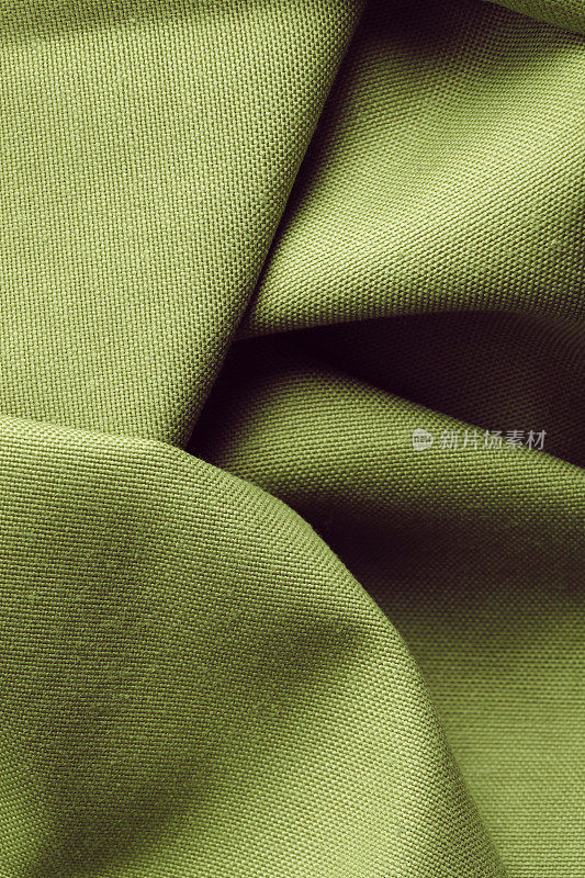 深绿色纺织品作为背景抽象