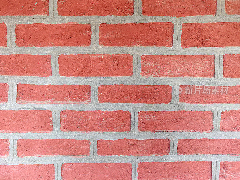 水平乡村背景红色grunge纹理砖图案与灰色砌体接缝墙上