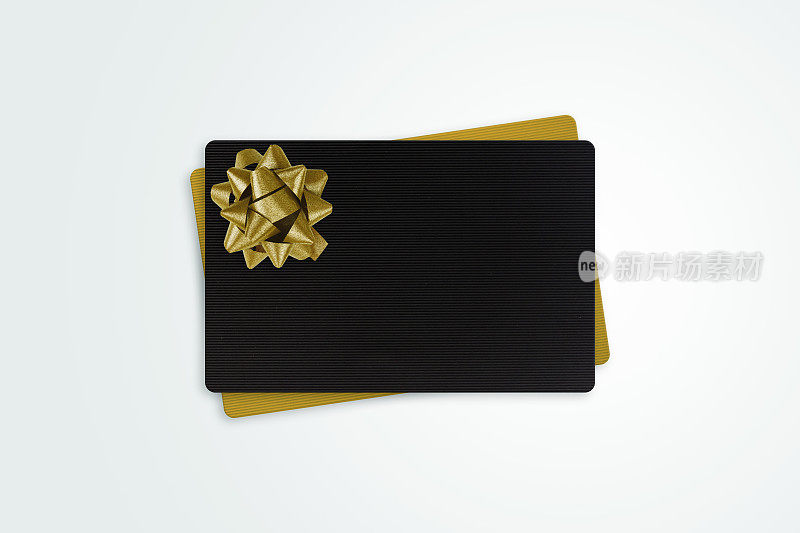 黑色和金色礼品卡与金色蝴蝶结丝带