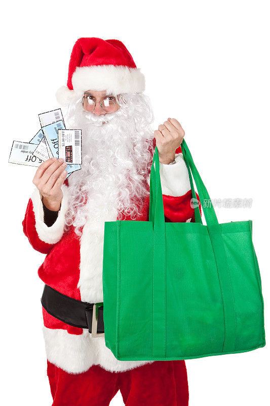 圣诞老人拿着优惠券和购物袋