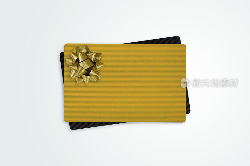 黑色和金色礼品卡与金色蝴蝶结丝带