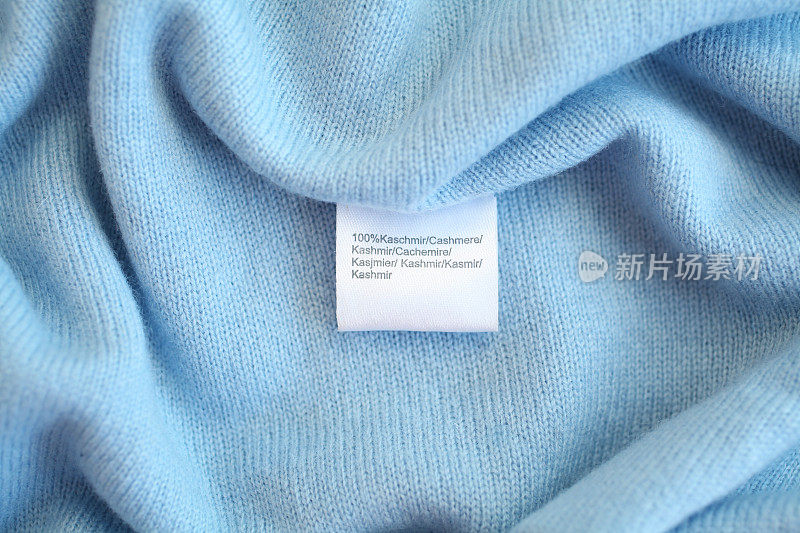 蓝色羊绒面料，带标签