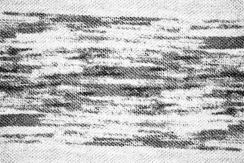 黑色和白色的笔刷在织物布的纹理背景