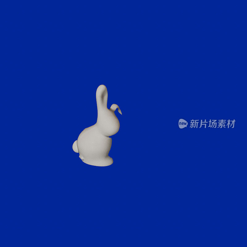 白色的小兔子雕像为中国新年ae海军蓝颜色的背景平lay概念。