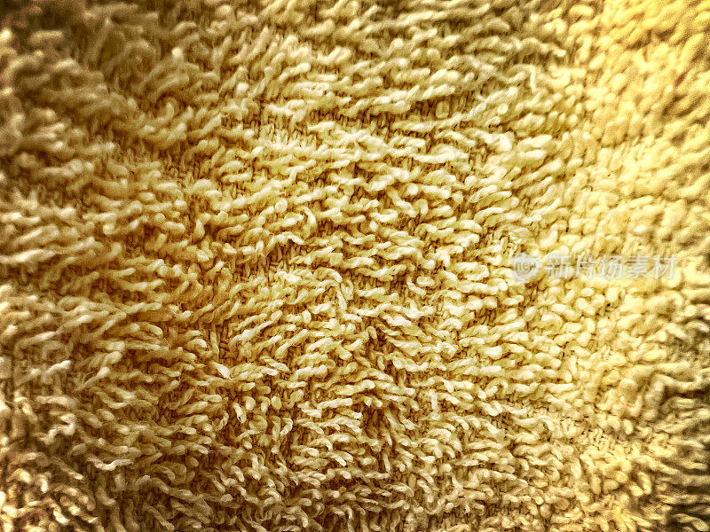 黄色毛巾的微距图像。
