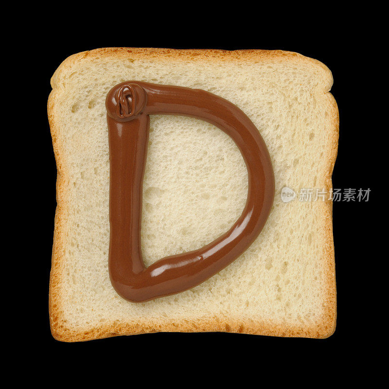 巧克力字母D在锡箔面包片上，黑色背景