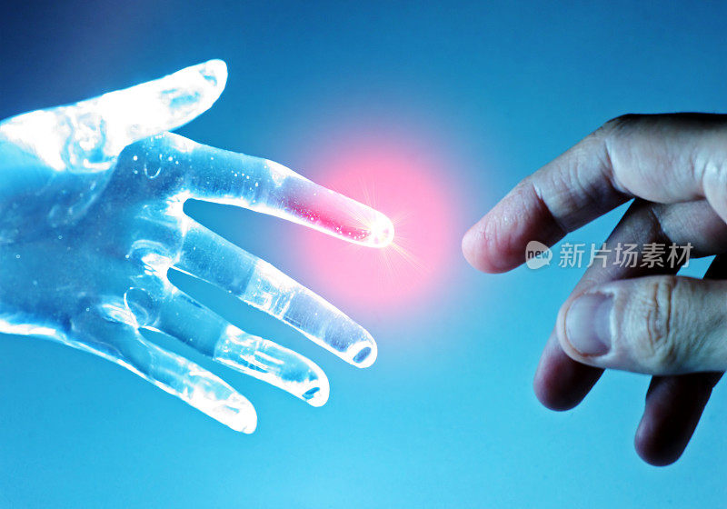 人工机器人的手触摸人类的手