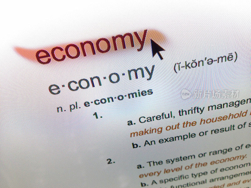 经济定义字典与鼠标箭头在电脑屏幕上