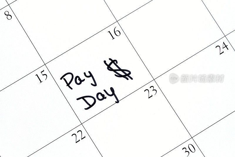 日历上写着发薪日和美元符号