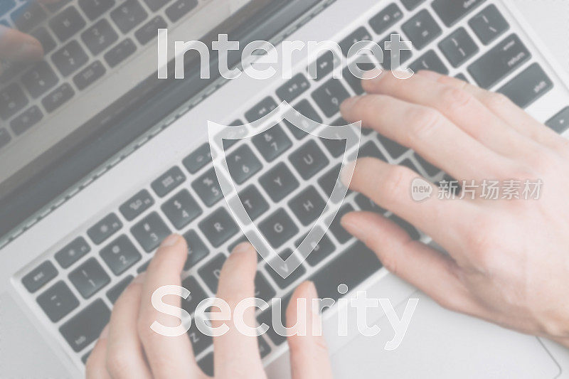 数据保护安全理念。模糊键盘背景上的计算机Internet保护符号。黑客攻击与数据泄露、信息泄露的概念。