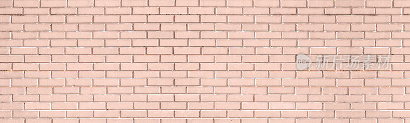 暖色调的米色老砖墙宽有纹理。粉彩桃橘色破旧的砖墙。摘要复古大光背景