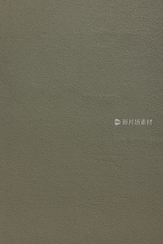 有纹理的卡其绿色混凝土墙的一部分