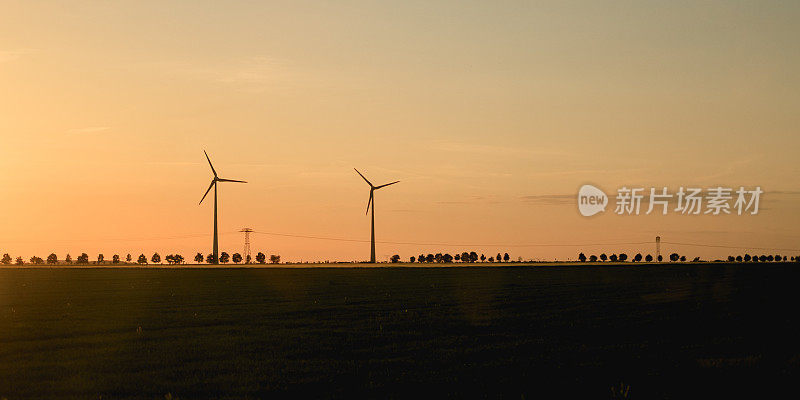风电场户外摄影。农田里的风电厂照片。图为风力发电站。风力发电厂，绿色能源理念。可再生能源的风力涡轮机。天空和日落，美丽的风景。