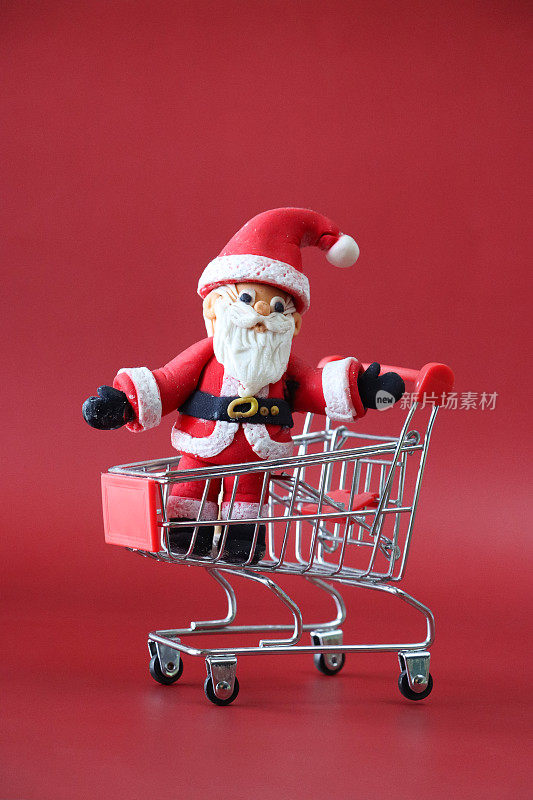 圣诞老人形象微型购物车，圣诞老人，圣诞购物，最后一刻节日零售采购