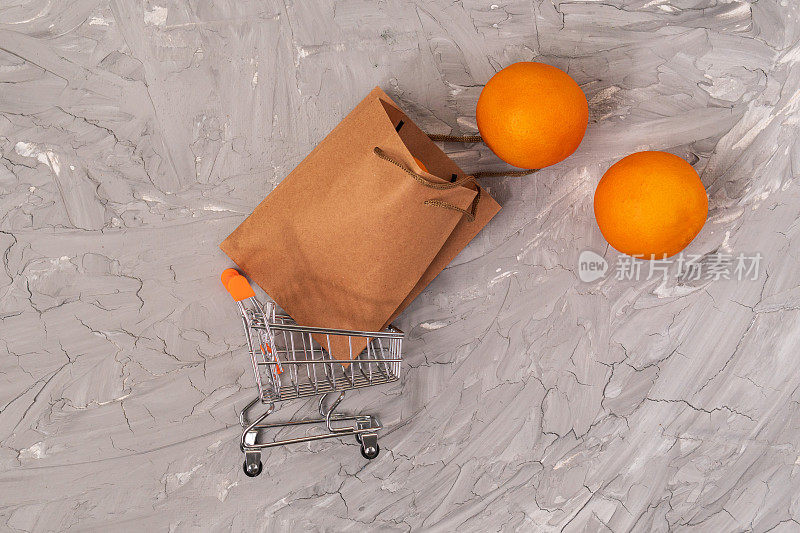 购物车与工艺袋，购买水果橙子。
