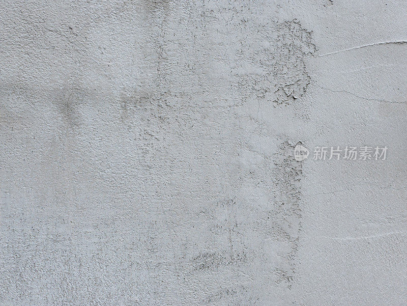 白色的墙壁，纹理不均匀。