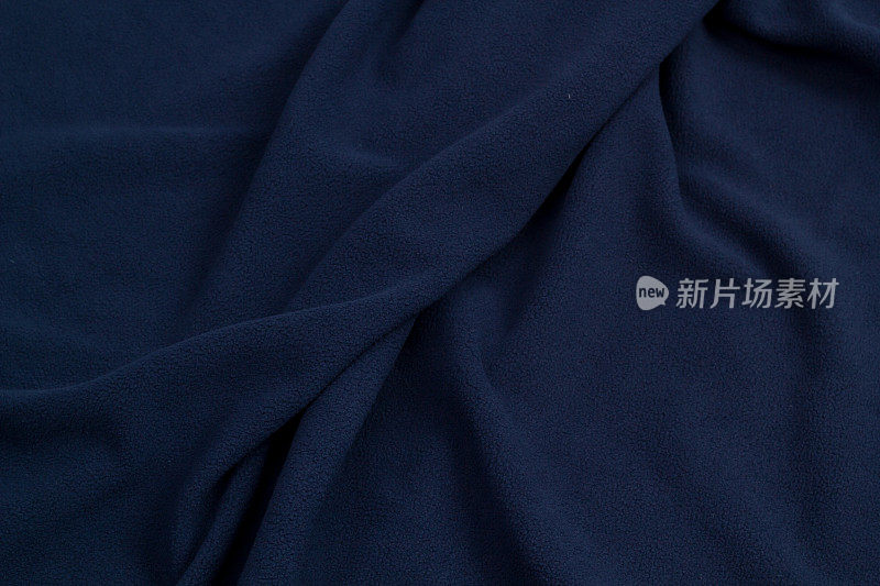 羊毛织物蓝色顶视图。纺织羊毛床罩的质地。