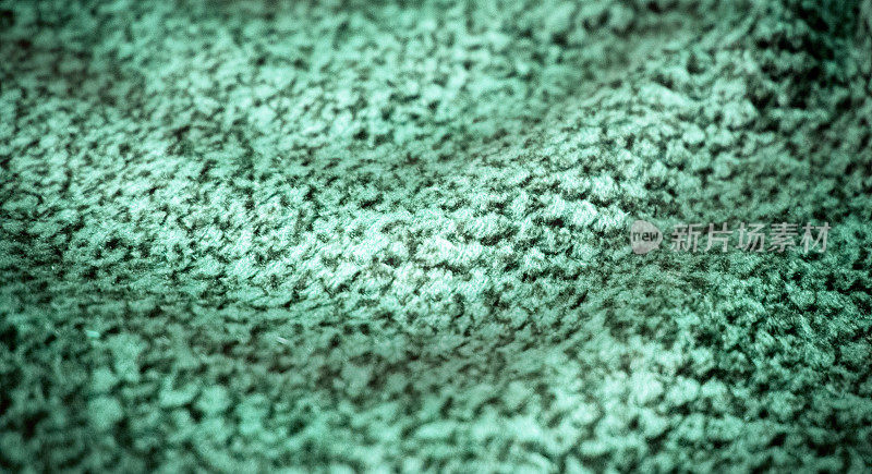 绿色面料，纺织品纹理，冬季布焦点模糊风格化暖毯背景