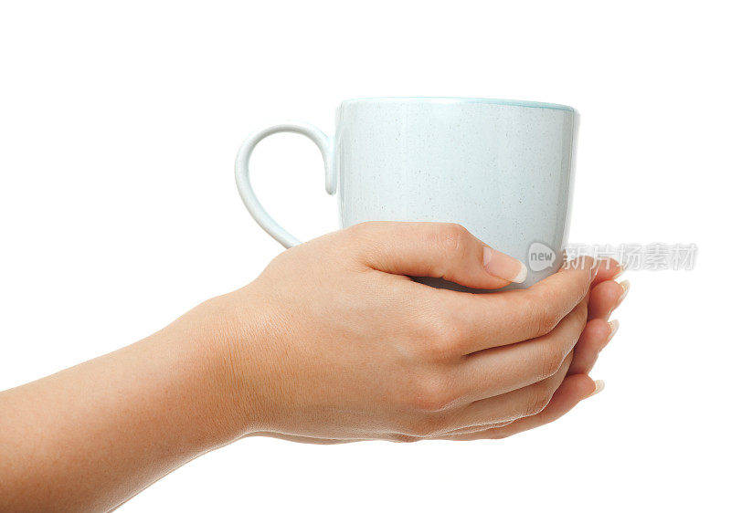女人手里拿着白色的咖啡杯