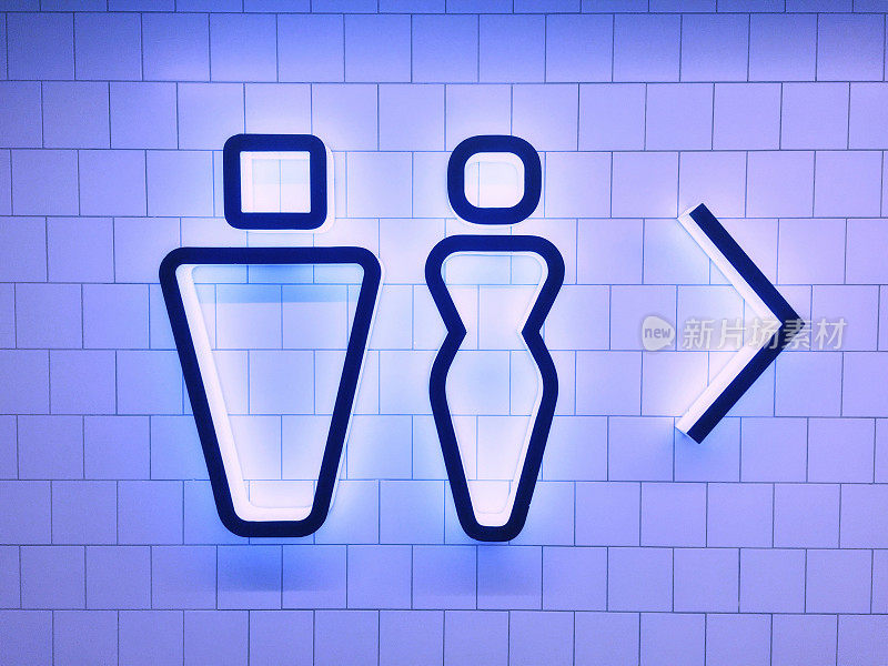 瓷砖墙上的现代霓虹厕所标识