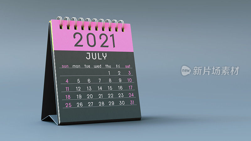 2021年日历笔记本，7月的页面是粉红色的，站在浅灰色的背景上