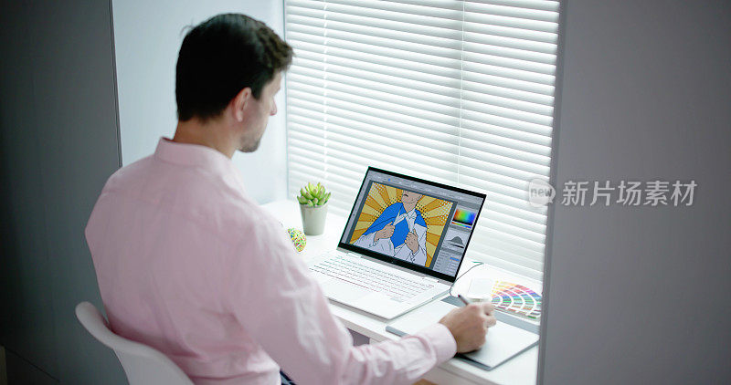男设计师在工作时使用平板电脑