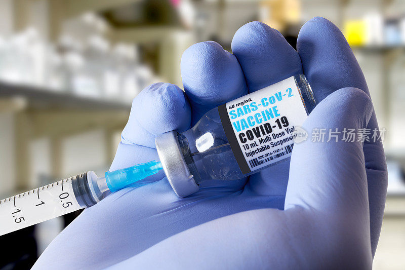 疫苗:Covid-19、冠状病毒疫苗，实验室用小瓶和手持注射器。